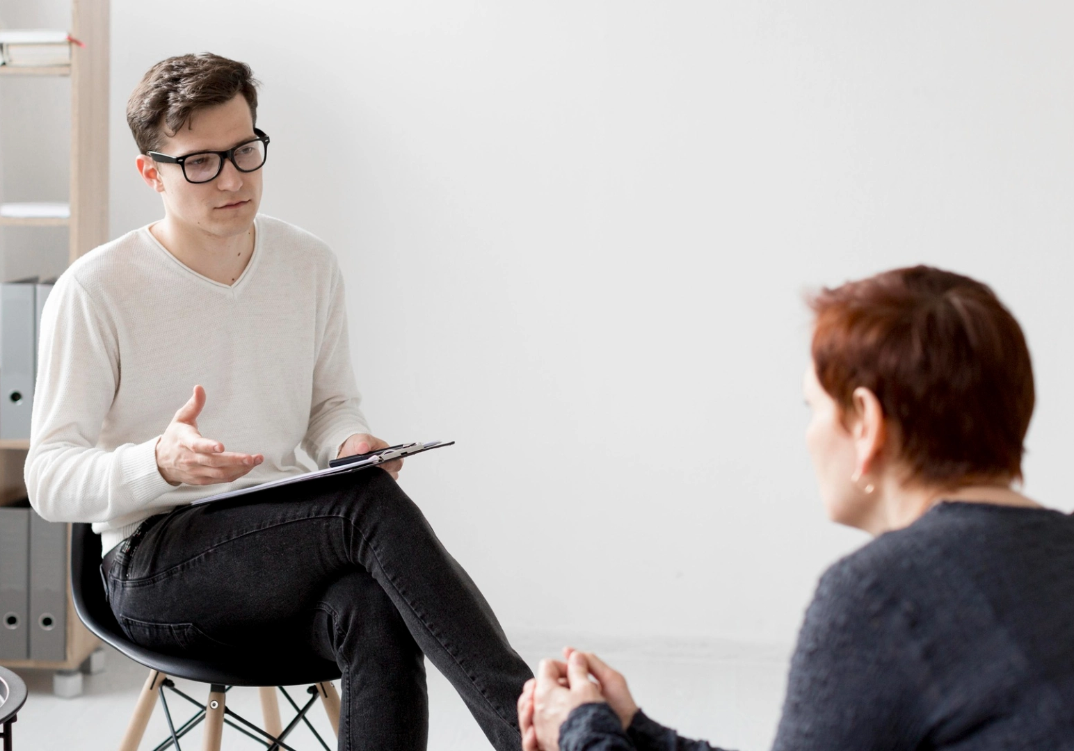Front view of psychologist consulting a patient Front view of psychologist consulting a patient